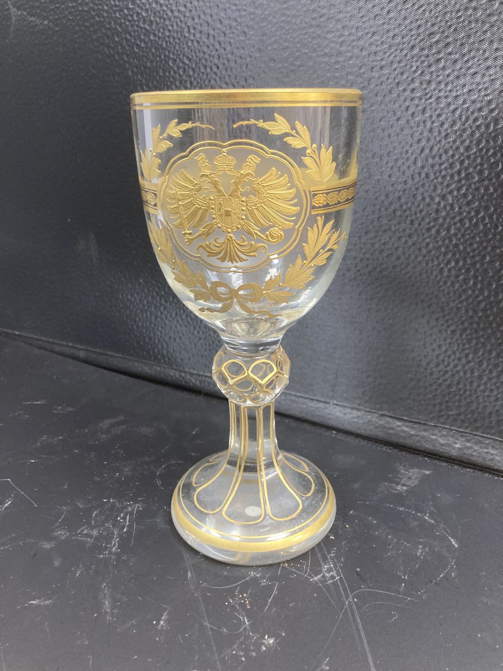 A Bohemian gilded glass goblet, c.1900, decorated with an Austrian Imperial Eagle, 18.5cm